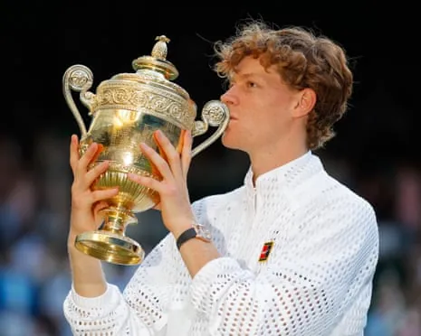 Jannik Sinner kisses the trophy