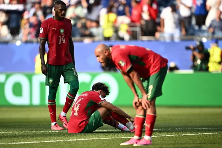 Morocco's Noussair Mazraoui, Issa Diop and Neil El Aynaoui look dejected after the france match as Morocco are eliminated from the World Cup